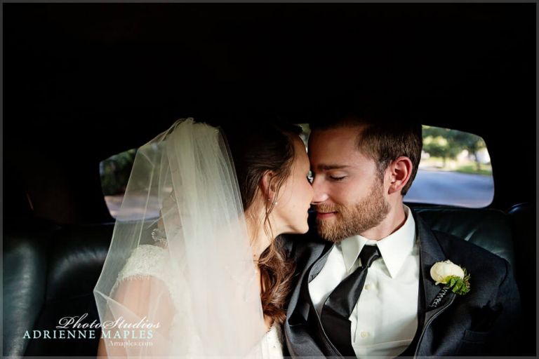 Small wedding photo moment bride groom kiss in car