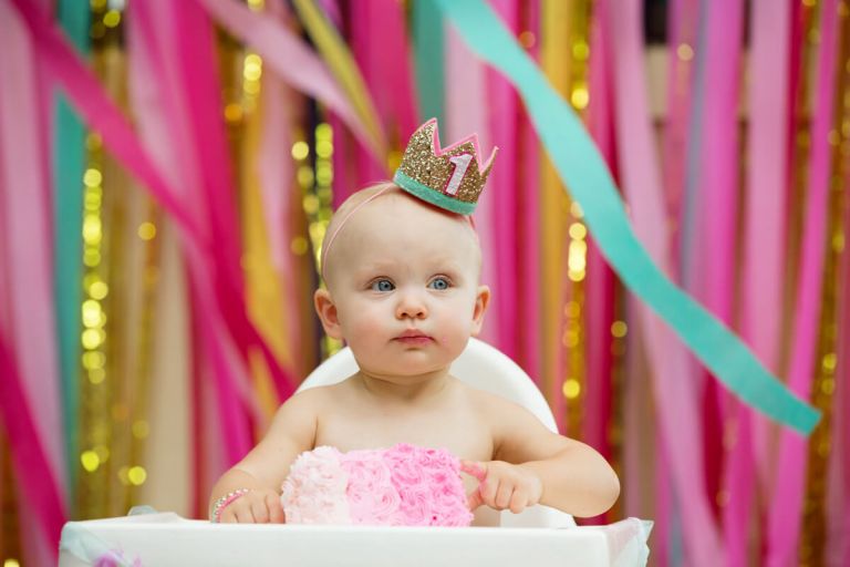 baby with birthday cake