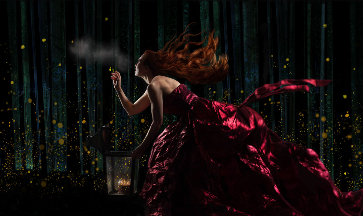 read headed woman in red dress with fireflies
