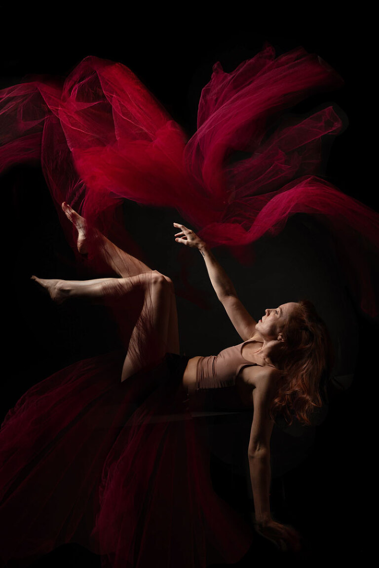 self portrait photograph of a woman falling in a fantasy fine art piece