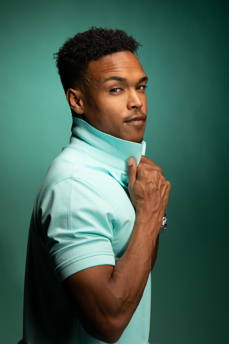 photograph of a guy model wearing sea green in this perfect photo composition